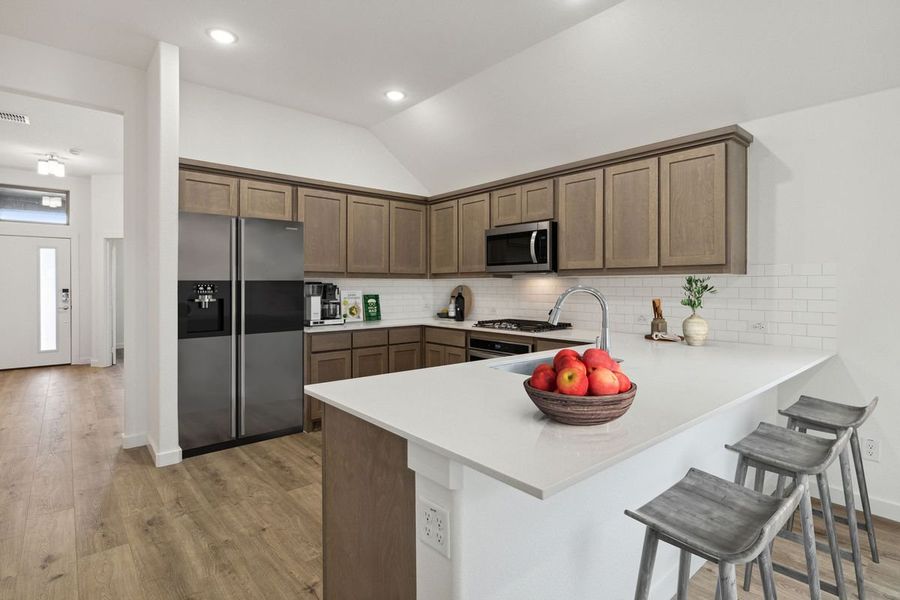 Kitchen in the Jade home plan by Trophy Signature Homes – REPRESENTATIVE PHOTO