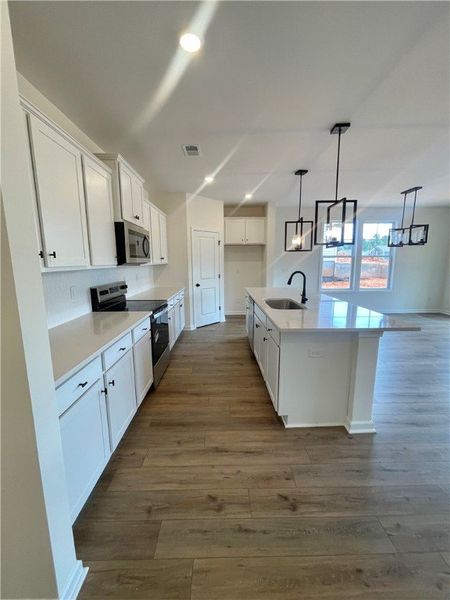 Furnished interior view inside a new home in Springwood Grove, Central (Image 6).