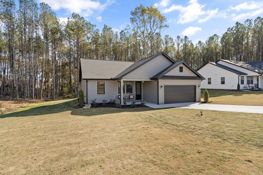Front exterior of a new home in Anderson County Homes, Belton, SC, highlighting curb appeal (Image 2). Front exterior of a new home in Anderson County Homes, Belton, SC, highlighting curb appeal (Image 2).