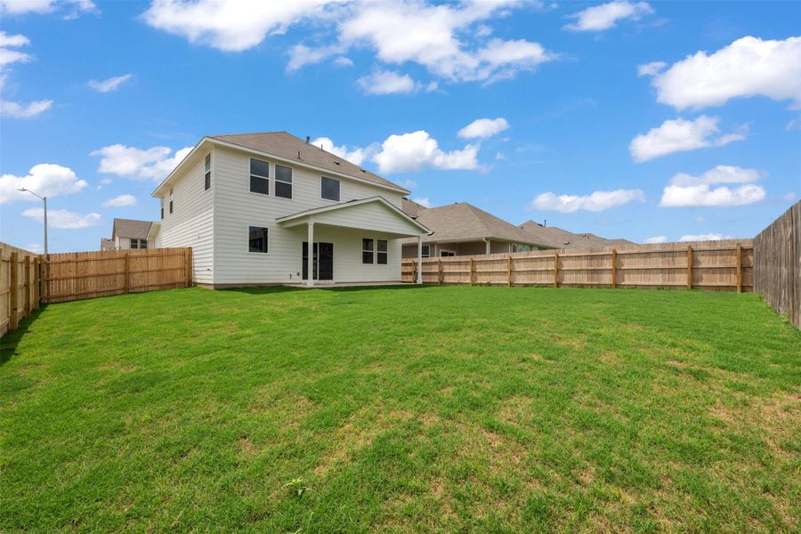 Exterior details and patio area of a home in Rolling Glen, Hutto (Image 16).