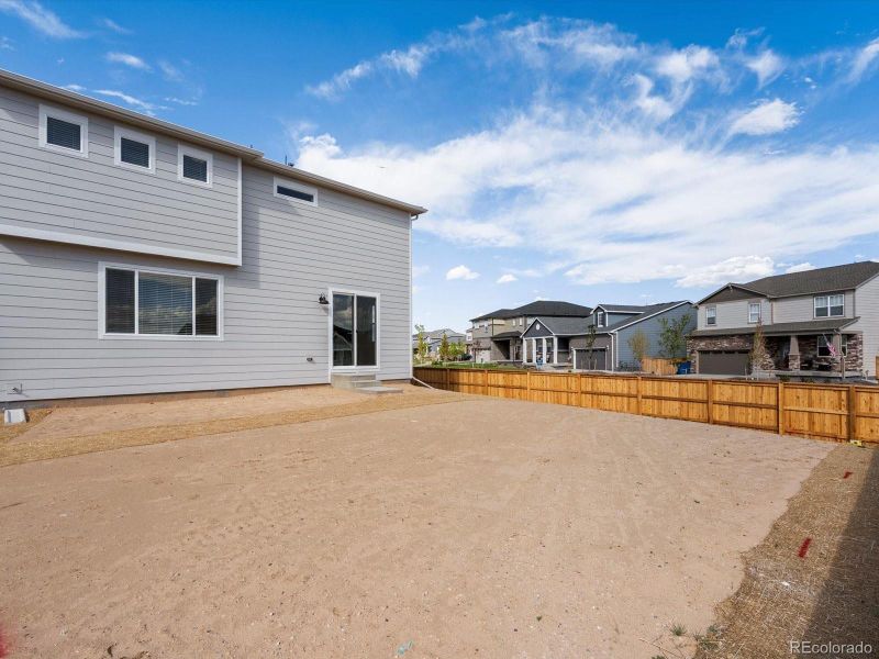 Front exterior of a new home in Ridgeline Vista: The Flora Collection, Brighton, CO, highlighting curb appeal (Image 2). Front exterior of a new home in Ridgeline Vista: The Flora Collection, Brighton, CO, highlighting curb appeal (Image 2).