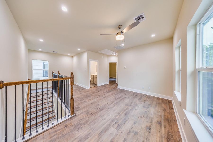 Spacious gameroom upstairs, perfect for family fun and entertaining guests. Spacious gameroom upstairs, perfect for family fun and entertaining guests.