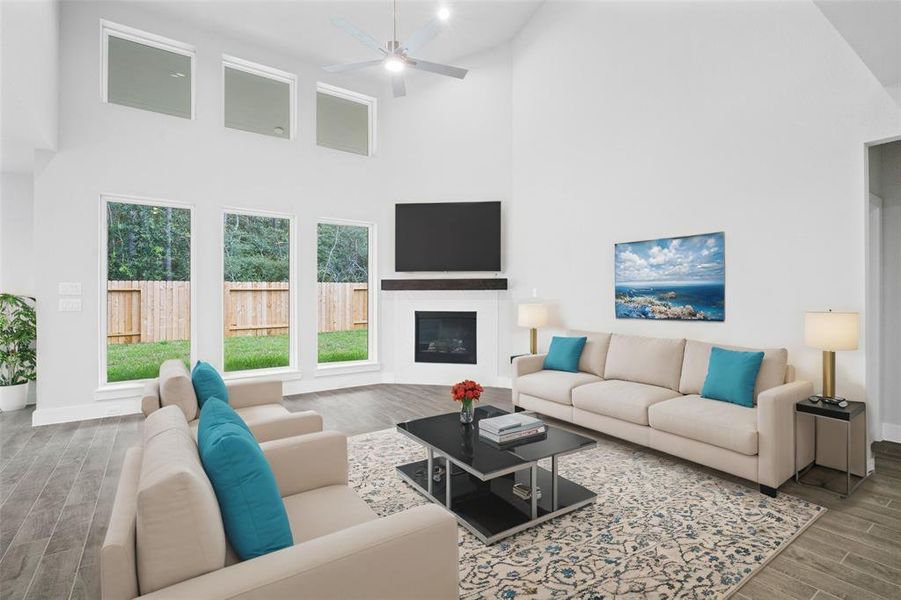 Gather the family and guests together in your lovely living room! Featuring high ceilings, recessed lighting, ceiling fan, custom paint, gorgeous tile floors and large windows that provide plenty of natural lighting throughout the day.