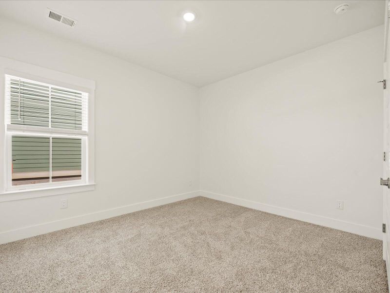 Spacious, unfurnished interior of a new home in The Coves at Lakes of Cane Bay II, Summerville (Image 24).