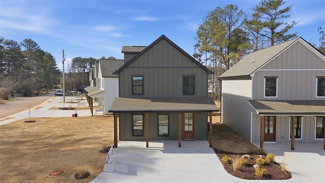 Front exterior of a new home in , Carrollton, GA, highlighting curb appeal (Image 19).