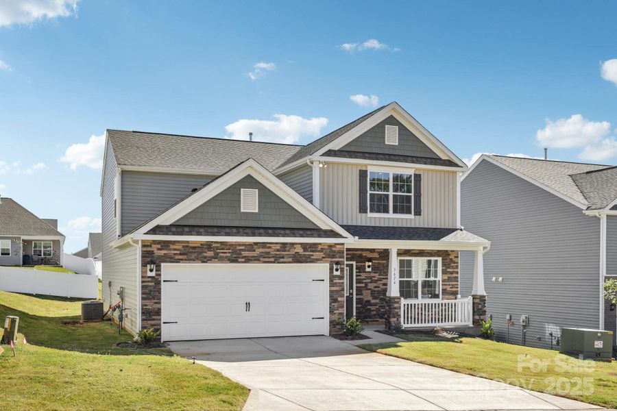 Front exterior of a new home in Cline Village, Conover, NC, highlighting curb appeal (Image 1).