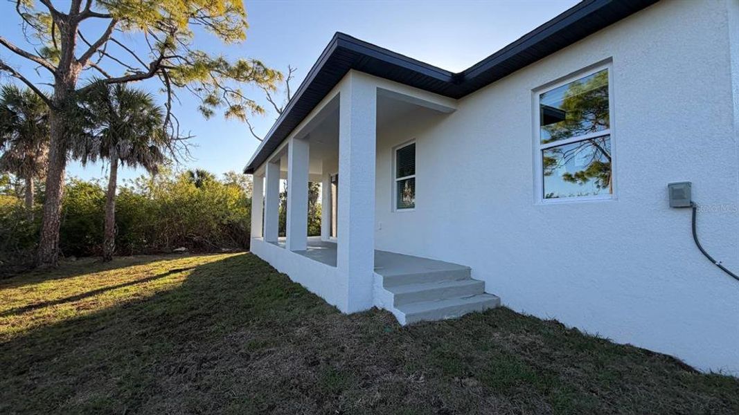 Exterior details and patio area of a home in , Port Charlotte (Image 24).