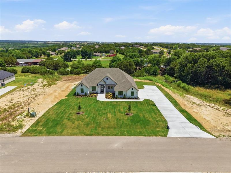 Front exterior of a new home in , Weatherford, TX, highlighting curb appeal (Image 21).