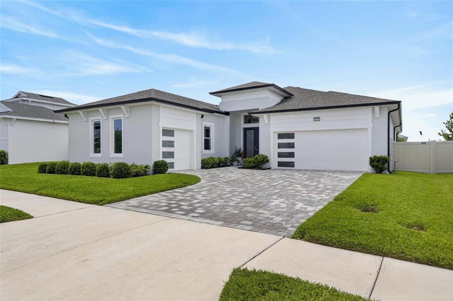 Front exterior of a new home in Robin's Cove at Epperson, Wesley Chapel, FL, highlighting curb appeal (Image 24).