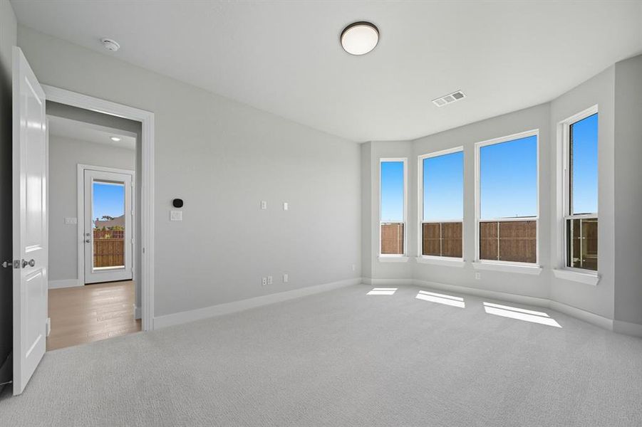 Unfurnished room featuring carpet