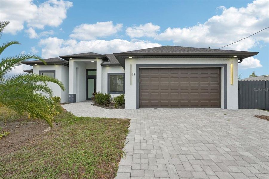 Front exterior of a new home in , Cape Coral, FL, highlighting curb appeal (Image 18).