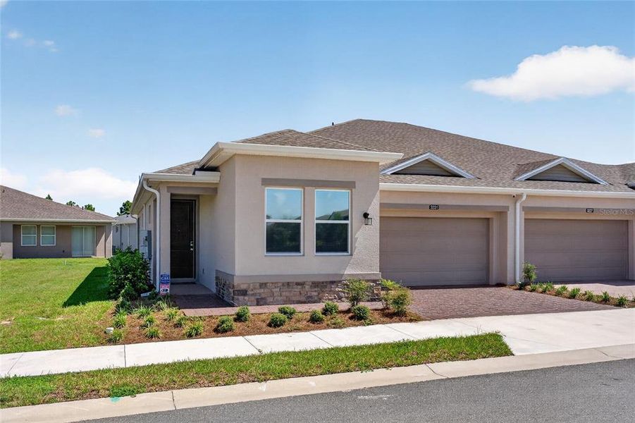 Front exterior of a new home in , Ocala, FL, highlighting curb appeal (Image 2). Front exterior of a new home in , Ocala, FL, highlighting curb appeal (Image 2).