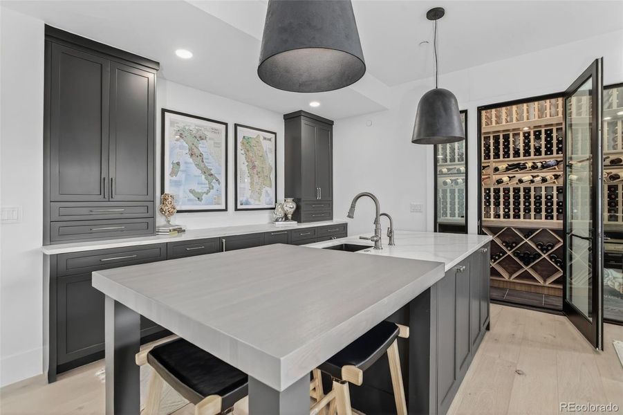 Lower level kitchen with space to entertain, serve drink and access the wine cellar Lower level kitchen with space to entertain, serve drink and access the wine cellar