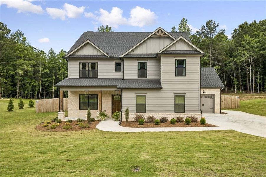 Front exterior of a new home in , Winder, GA, highlighting curb appeal (Image 27). Front exterior of a new home in , Winder, GA, highlighting curb appeal (Image 27).