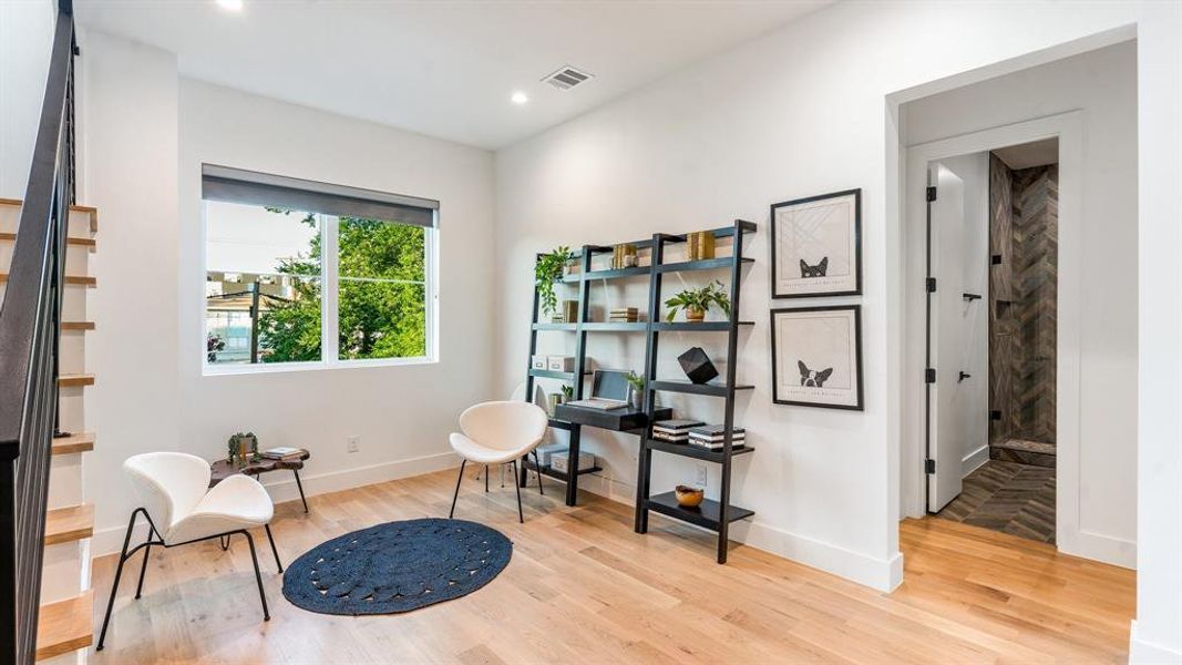 Living area featuring light hardwood / wood-style flooring