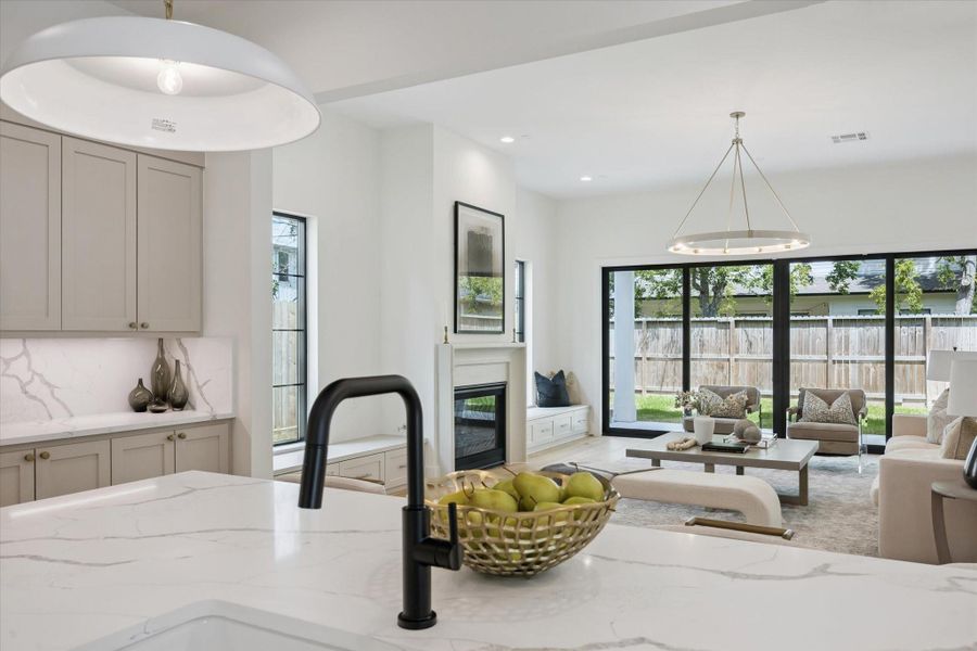 What a nice view looking out to the grounds. Sliders line the back door for those perfect entertaining evenings or wild kids running in and out to the pool and garden. What a nice view looking out to the grounds. Sliders line the back door for those perfect entertaining evenings or wild kids running in and out to the pool and garden.