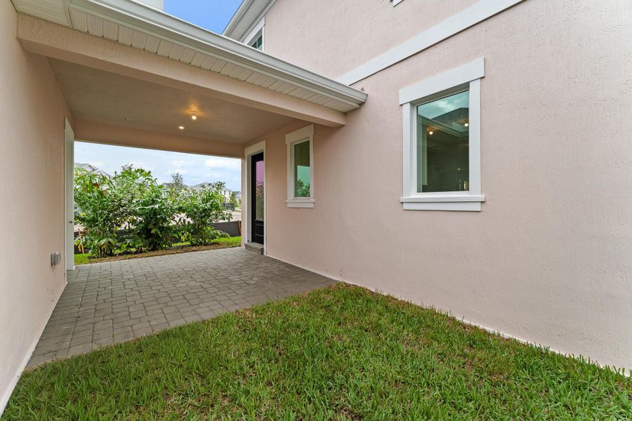 Exterior details and patio area of a home in Newfield - Rosette Park, Palm City (Image 3). Exterior details and patio area of a home in Newfield - Rosette Park, Palm City (Image 3).