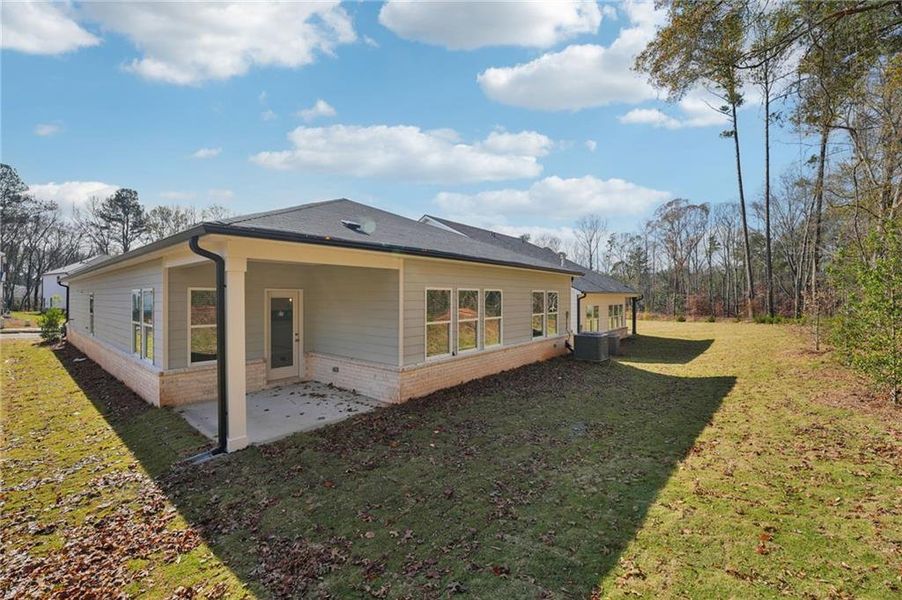Exterior details and patio area of a home in Westmont Preserve, Powder Springs (Image 3).