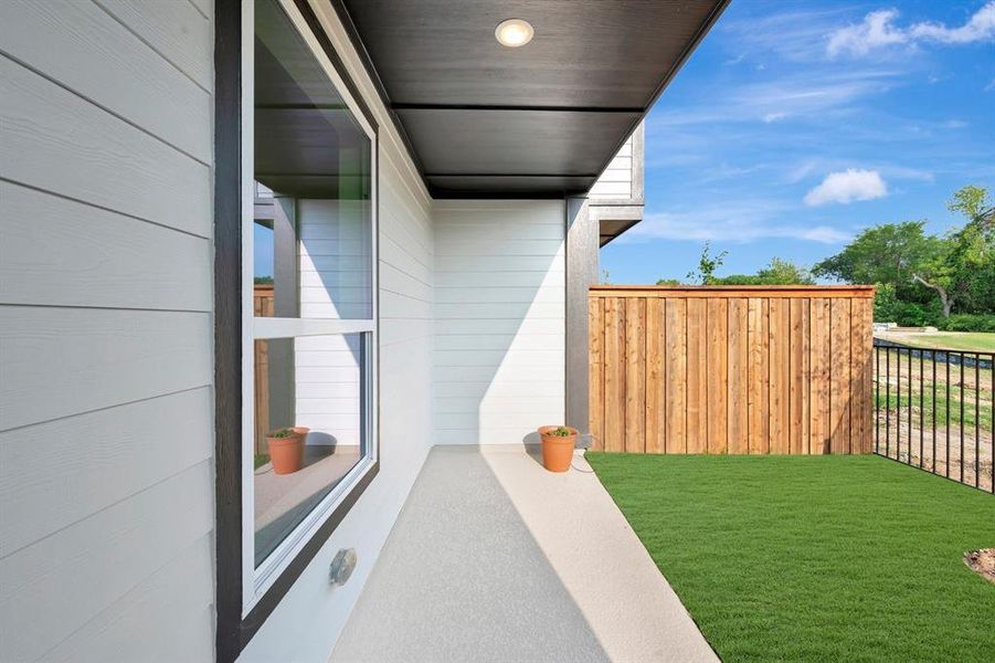 Exterior details and patio area of a home in Trails at Waterside - Villas Series, Fort Worth (Image 28).
