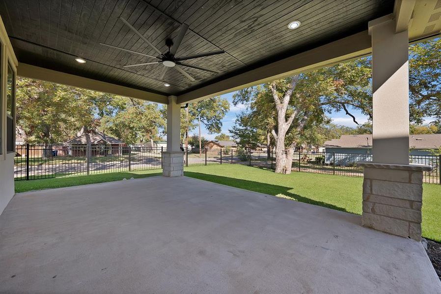 View of patio / terrace featuring ceiling fan and a residential view View of patio / terrace featuring ceiling fan and a residential view