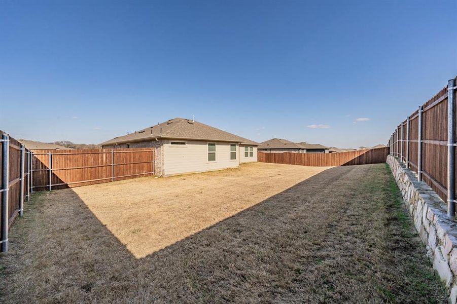 Exterior details and patio area of a home in Stone Eagle, Azle (Image 21).