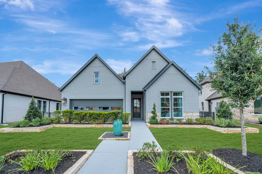 Representative exterior photo of a completed home built from the The Cornwall by David Weekley Homes in The Highlands Encore - Tranquil Collection, Porter, TX (Image 2). Representative exterior photo of a completed home built from the The Cornwall by David Weekley Homes in The Highlands Encore - Tranquil Collection, Porter, TX (Image 2).