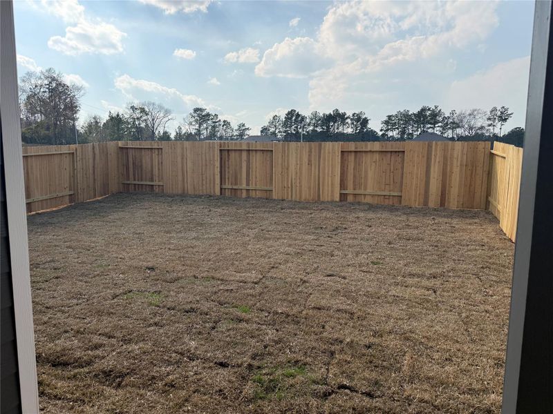 Exterior details and patio area of a home in River's Edge, Conroe (Image 3).
