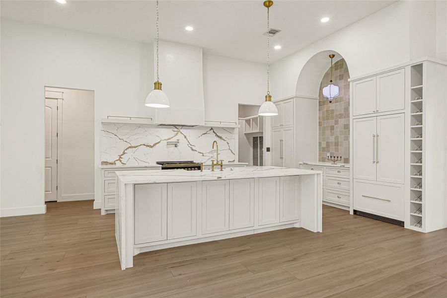 Custom kitchen with integrated cabinet paneled refrigerator