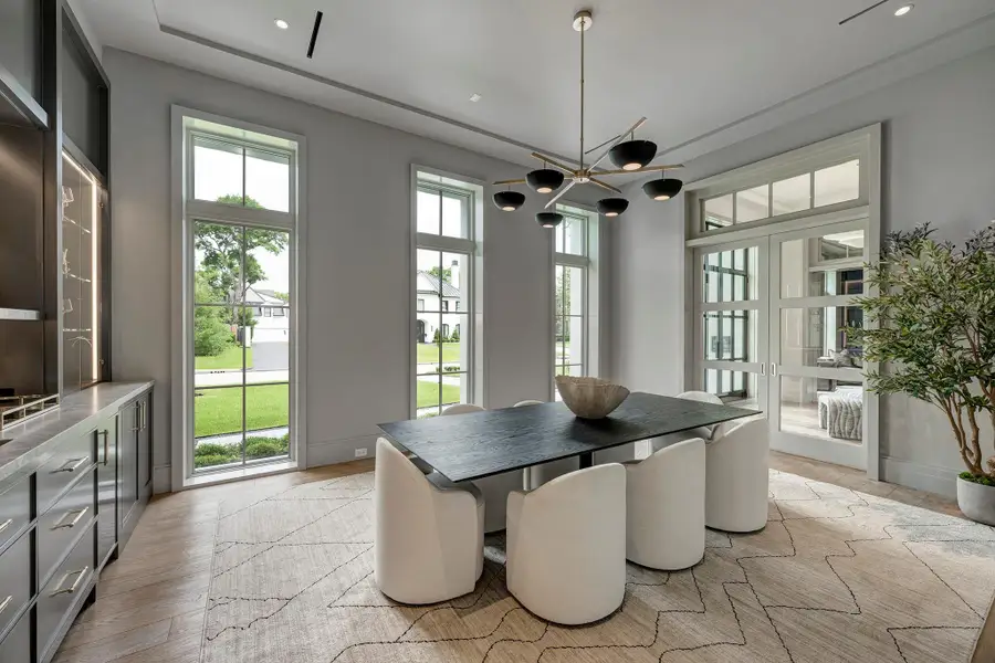 This room was designed for hospitality and includes a wet bar, Subzero wine frig, glass display shelves and Scotsman icemaker.