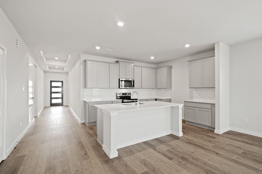 A kitchen with white cabinets. A kitchen with white cabinets.