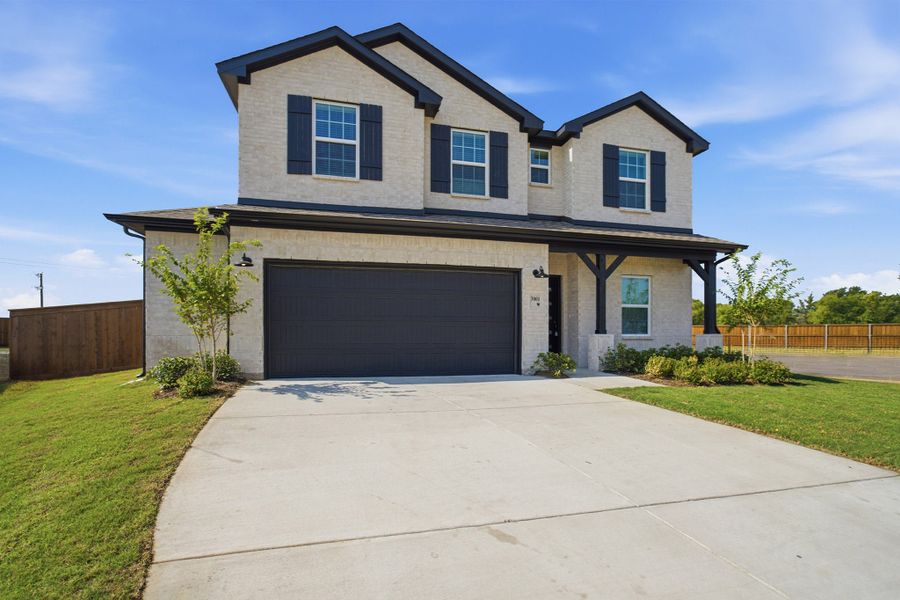 Front exterior of a new home in Heartland, Heartland, TX, highlighting curb appeal (Image 21). Front exterior of a new home in Heartland, Heartland, TX, highlighting curb appeal (Image 21).