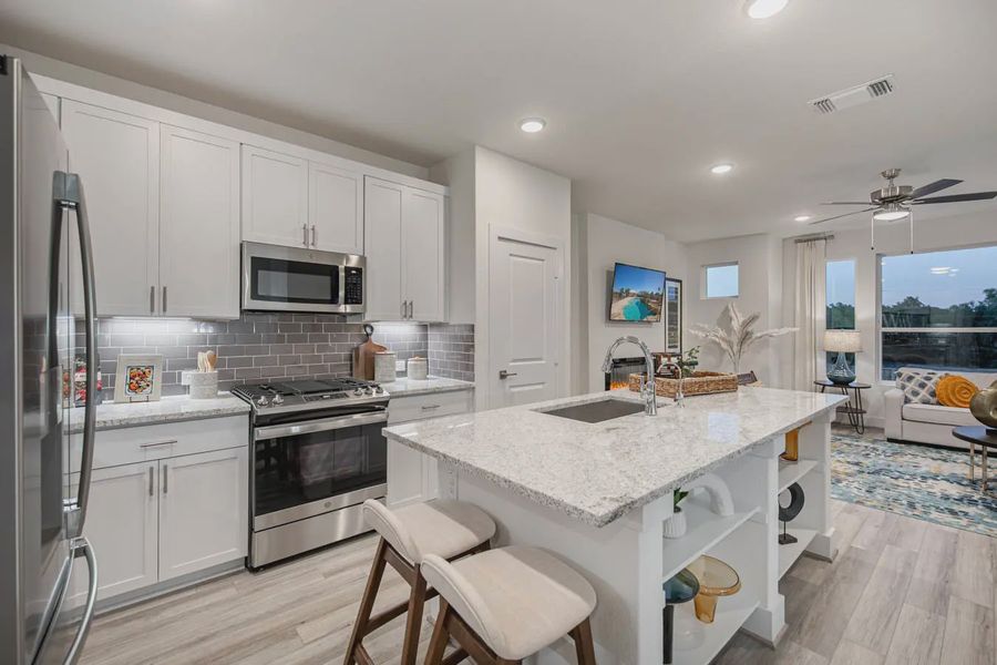 Representative furnished interior of a home built from the Calypso by Chesmar Homes in Prominence Urban, San Antonio (Image 6).