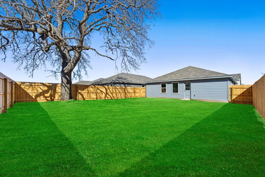 Exterior details and patio area of a home in Friendship Oaks, Fredericksburg (Image 2).