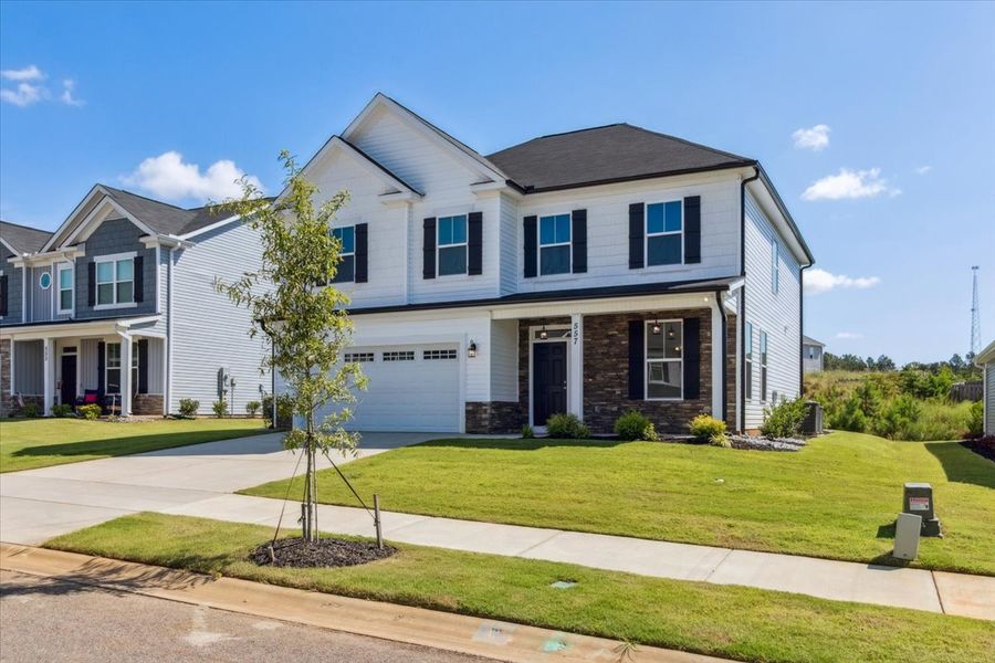 Front exterior of a new home in Windsor, North Augusta, SC, highlighting curb appeal (Image 16). Front exterior of a new home in Windsor, North Augusta, SC, highlighting curb appeal (Image 16).