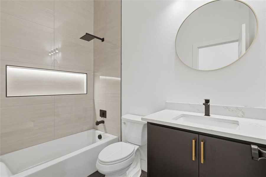 Bathroom with vanity and bathing tub / shower combination Bathroom with vanity and bathing tub / shower combination