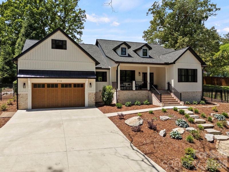 Front exterior of a new home in , Hendersonville, NC, highlighting curb appeal (Image 22).