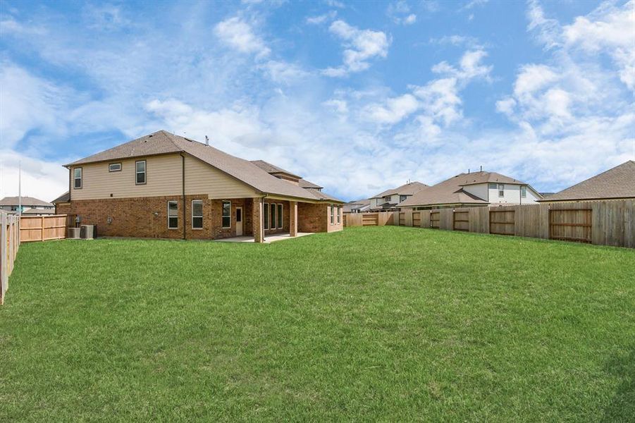 Backyard retreat, offering an abundance of space for kids to play and explore. The possibilities are endless in this outdoor haven, where the joy of open-air activities and family gatherings awaits.