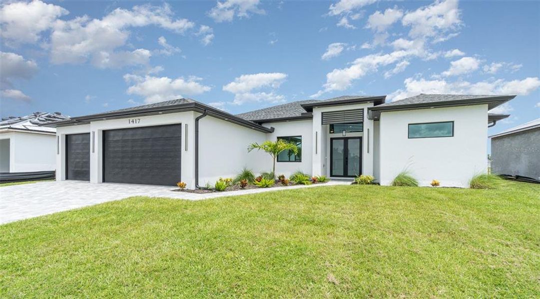 Front exterior of a new home in , Cape Coral, FL, highlighting curb appeal (Image 25).