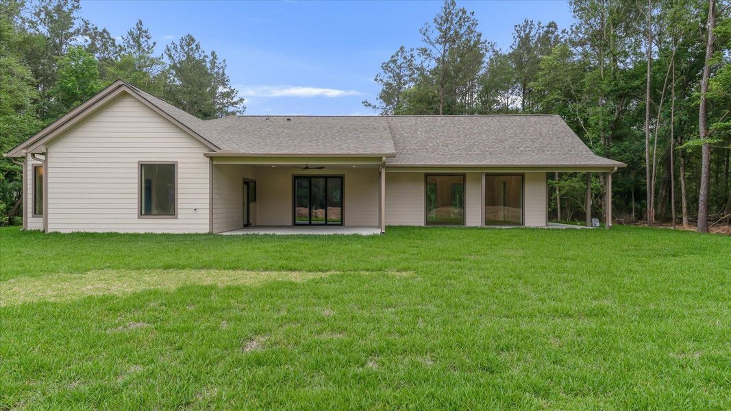Exterior details and patio area of a home in , Conroe (Image 22).