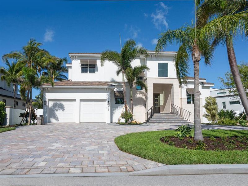 Front exterior of a new home in , Sarasota, FL, highlighting curb appeal (Image 1).