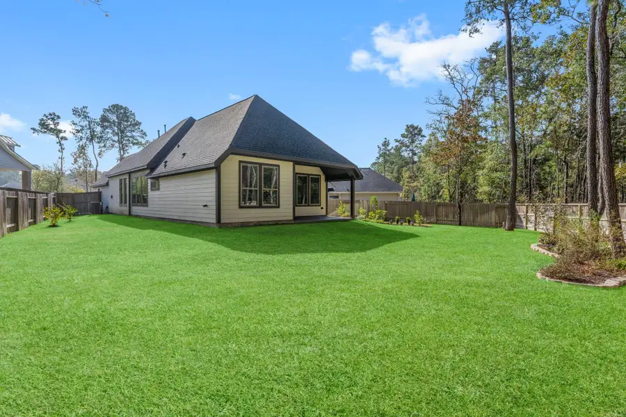 Exterior details and patio area of a home in Woodforest 40', Montgomery (Image 3).
