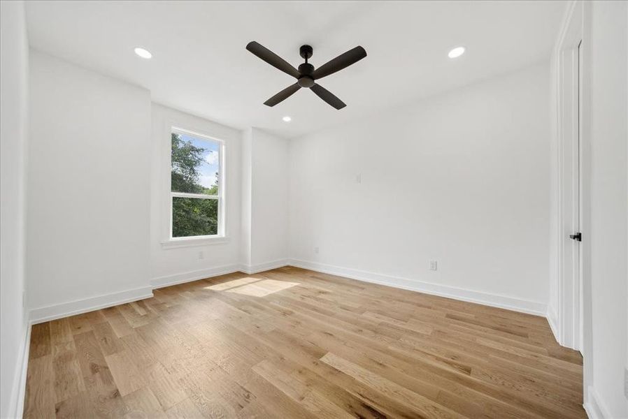 Bedroom featuring light hardwood flooring and ceiling fan