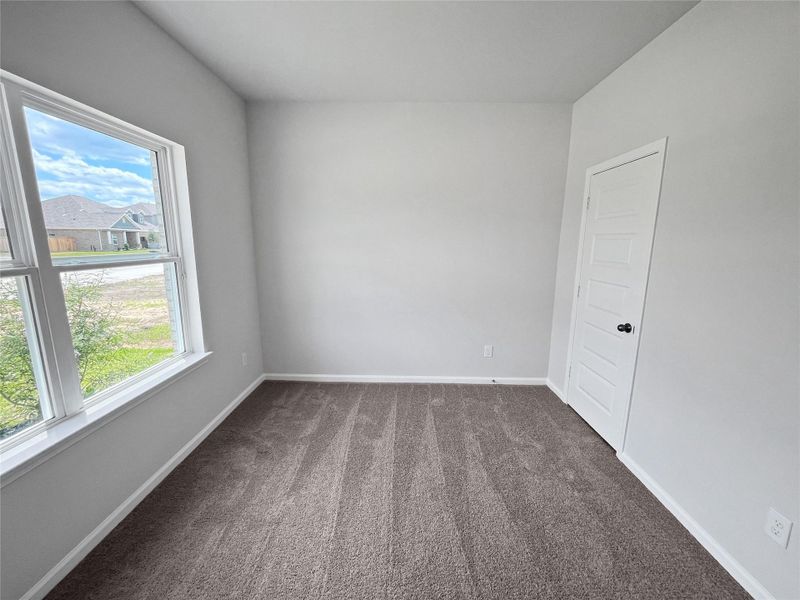 The Crawford- Bedroom 2. Home under construction. Sample floor plan photo used for illustrative purposes only. Upgrades, selections options, windows and colors may vary. The Crawford- Bedroom 2. Home under construction. Sample floor plan photo used for illustrative purposes only. Upgrades, selections options, windows and colors may vary.