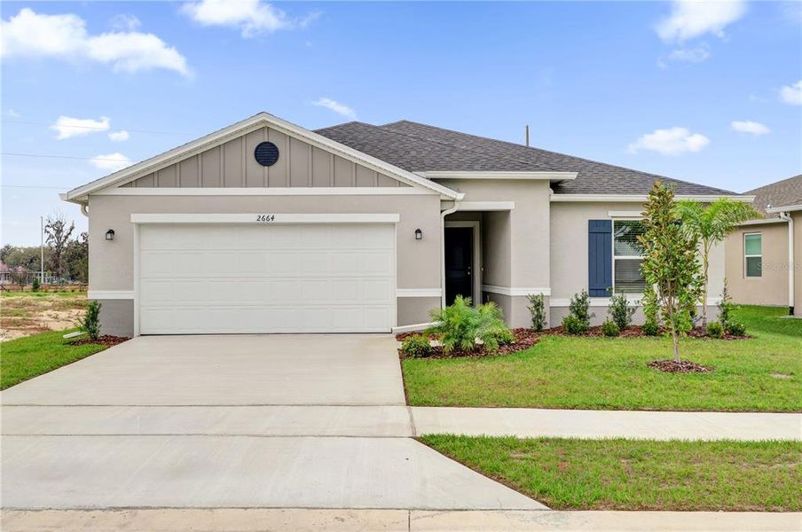 Front exterior of a new home in Hancock Crossings, Bartow, FL, highlighting curb appeal (Image 1). Front exterior of a new home in Hancock Crossings, Bartow, FL, highlighting curb appeal (Image 1).