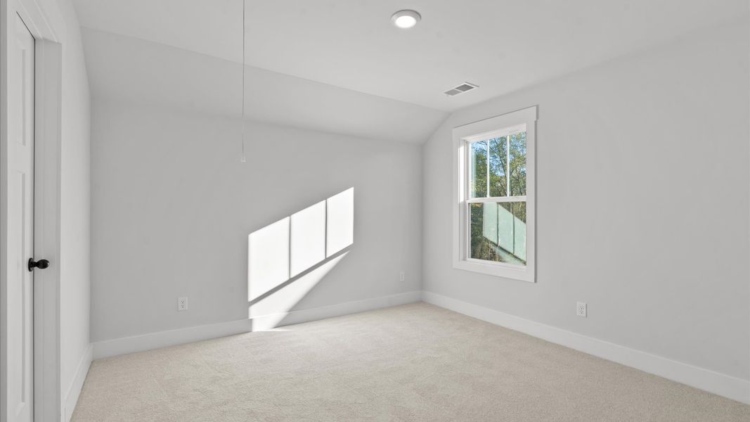 Memorable space with walk-in closet, soft carpeting, and striking natural light from large windows Memorable space with walk-in closet, soft carpeting, and striking natural light from large windows