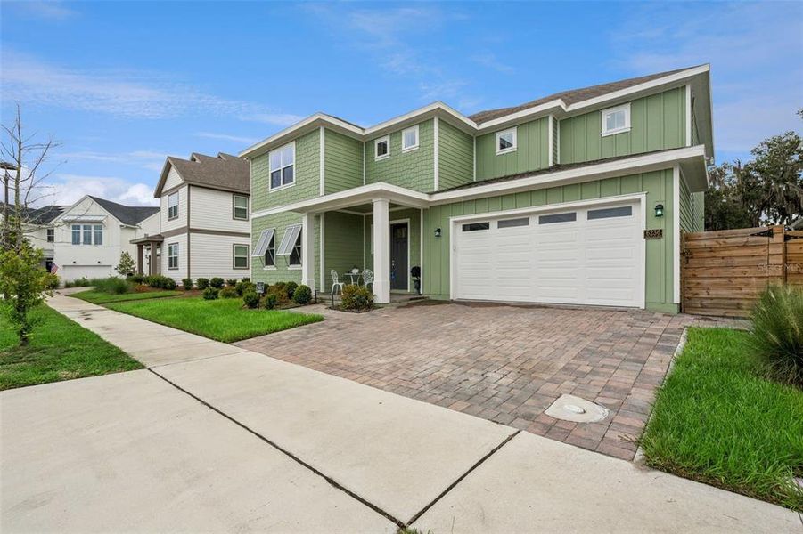 Front exterior of a new home in Weslyn Park at Sunbridge, St. Cloud, FL, highlighting curb appeal (Image 25).