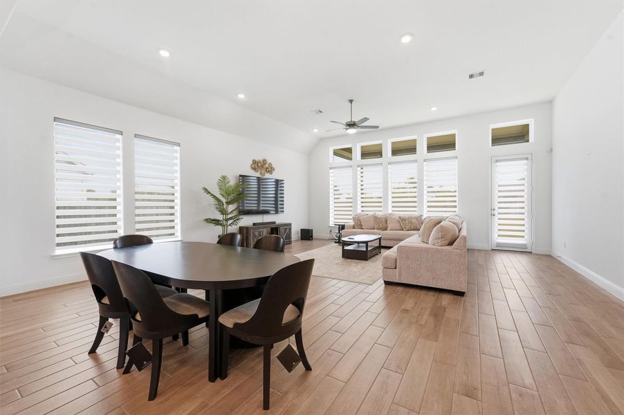 Open plan dining area overlooking kitchen and living room