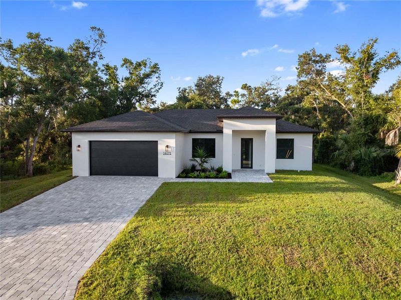 Front exterior of a new home in , Port Charlotte, FL, highlighting curb appeal (Image 23).