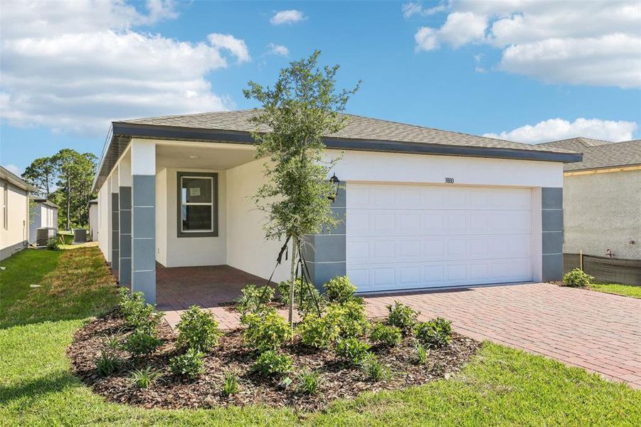 Front exterior of a new home in Villamar - Classic Series, Winter Haven, FL, highlighting curb appeal (Image 1). Front exterior of a new home in Villamar - Classic Series, Winter Haven, FL, highlighting curb appeal (Image 1).
