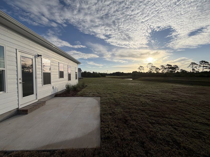 Exterior details and patio area of a home in Songbird, Hampstead (Image 20).
